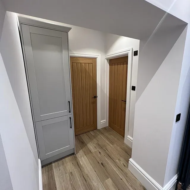 Bedrooms and Bathroom Refurbishment in Chilcompton - white painted walls with grey wardrobe